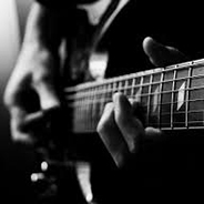 Image of a guitarist playing a guitar