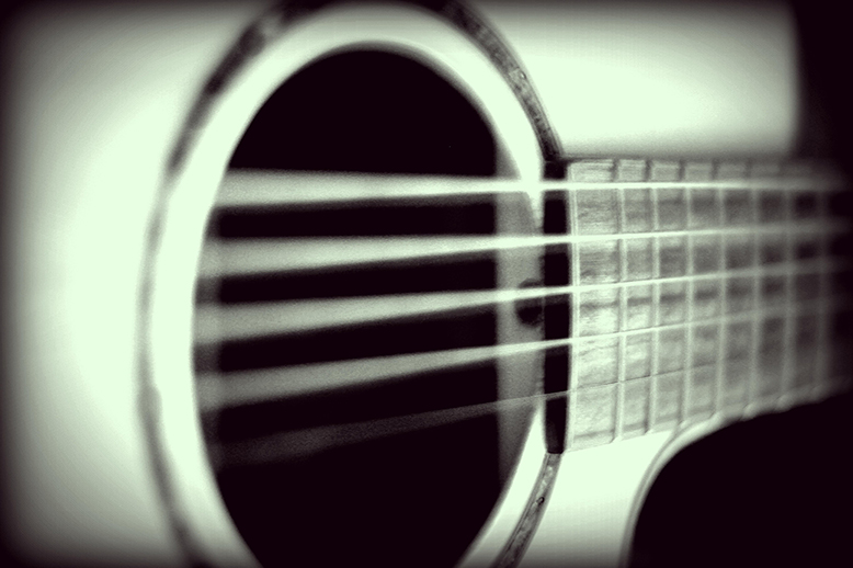 Image of close up acoustic guitar